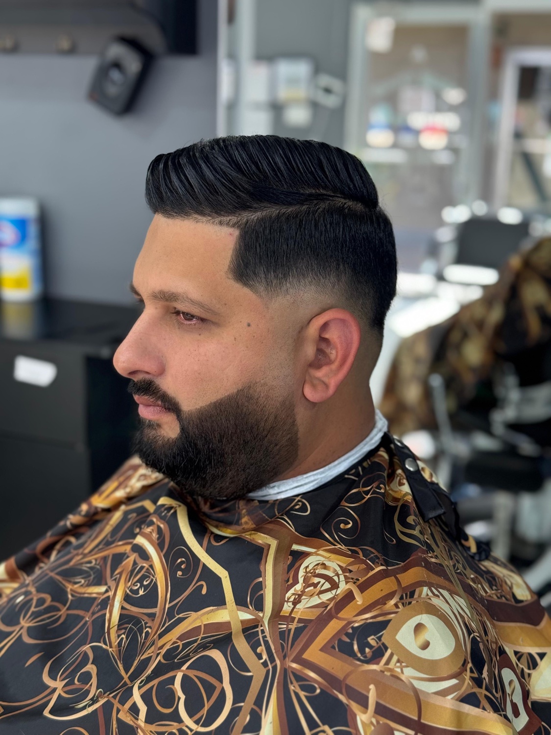 Beard sculpt paired with a clean fade