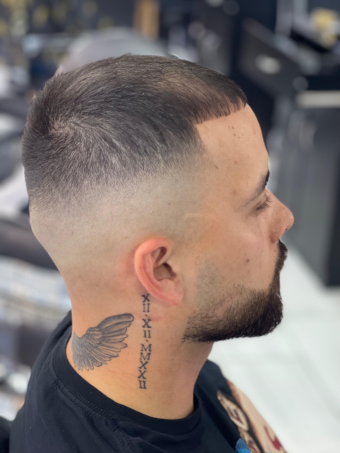 Skin fade with sharp lineup at Omar's Barbershop