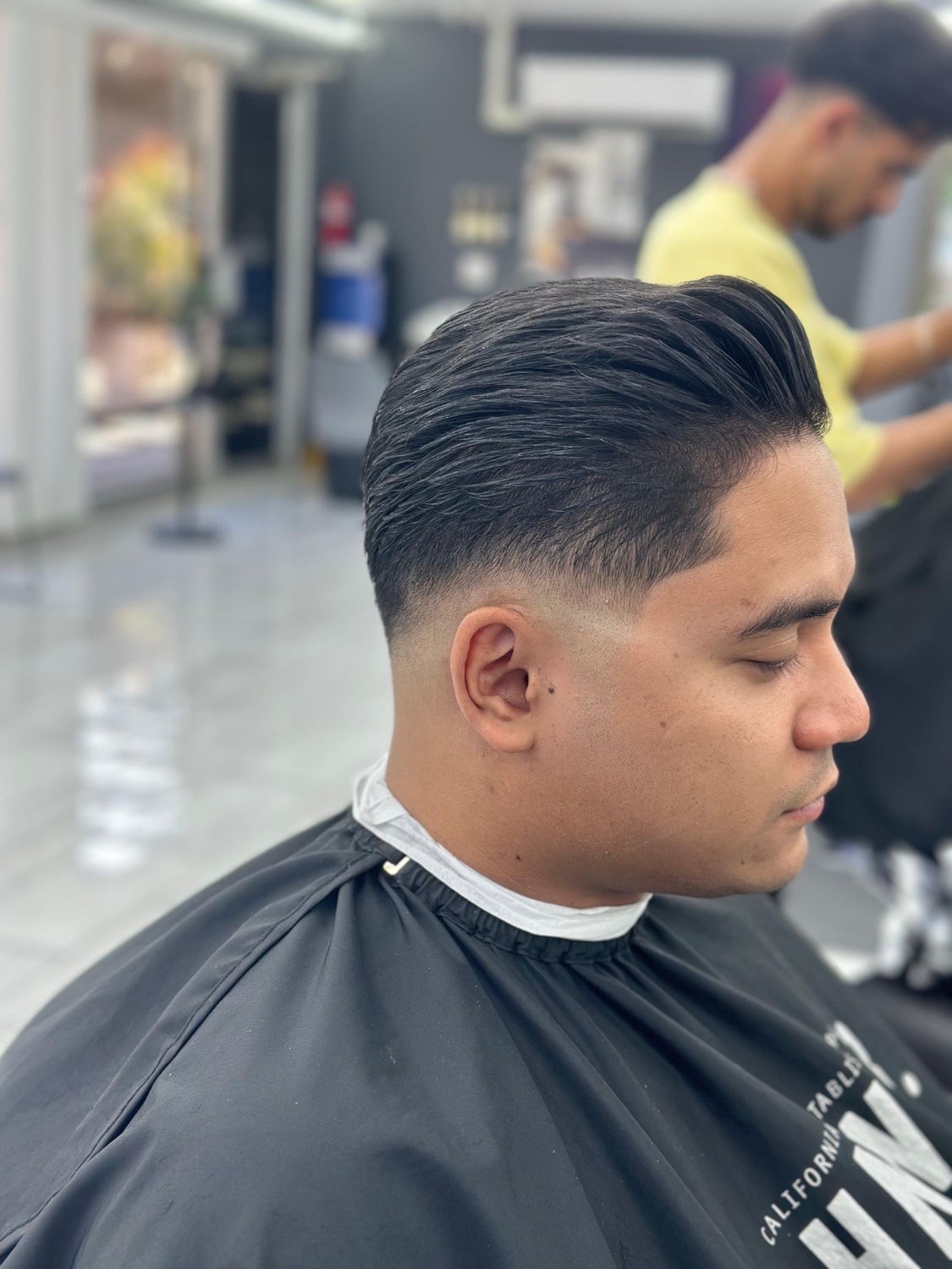 Slicked-back style with a clean fade